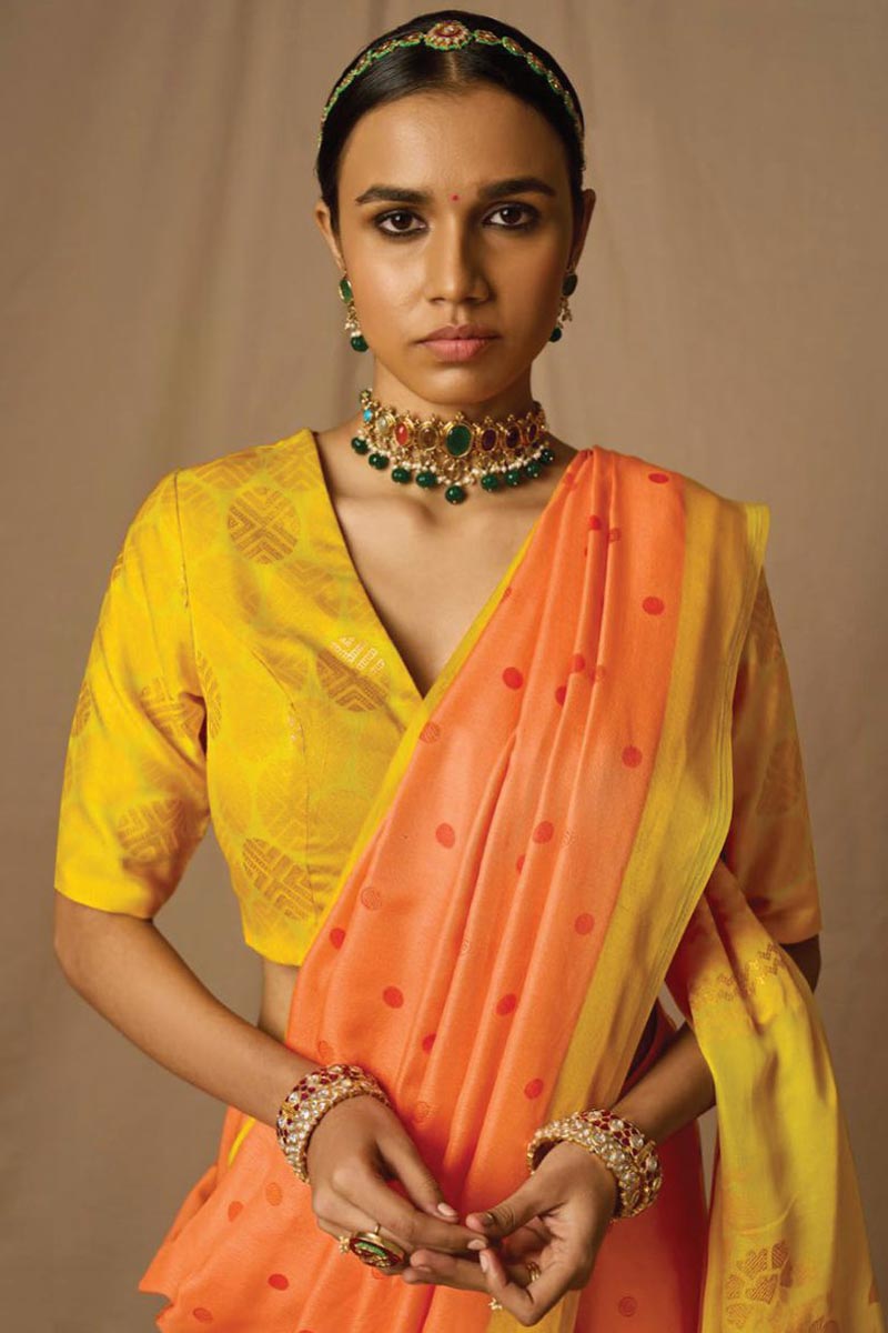 Engaging Orange Brasso Fabric Saree With Weaving Work