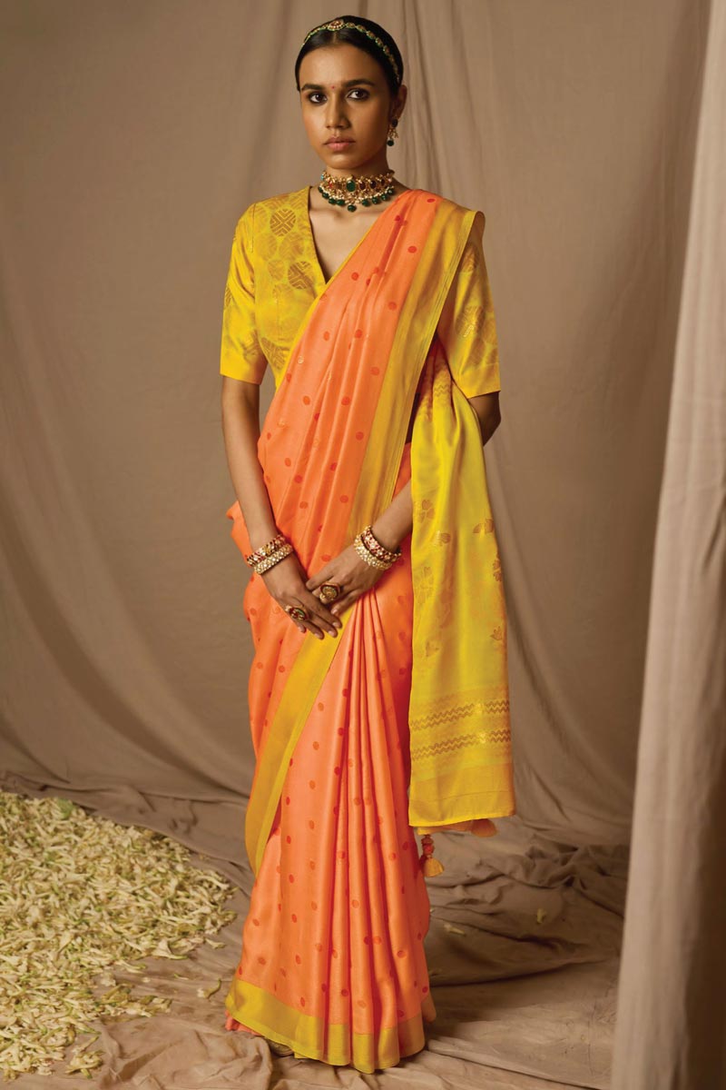 Engaging Orange Brasso Fabric Saree With Weaving Work