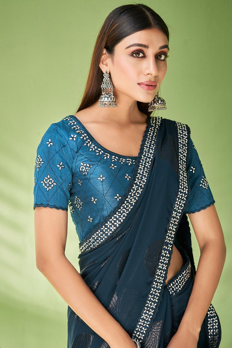 Fantastic Foil Printed Georgette Saree In Teal Color