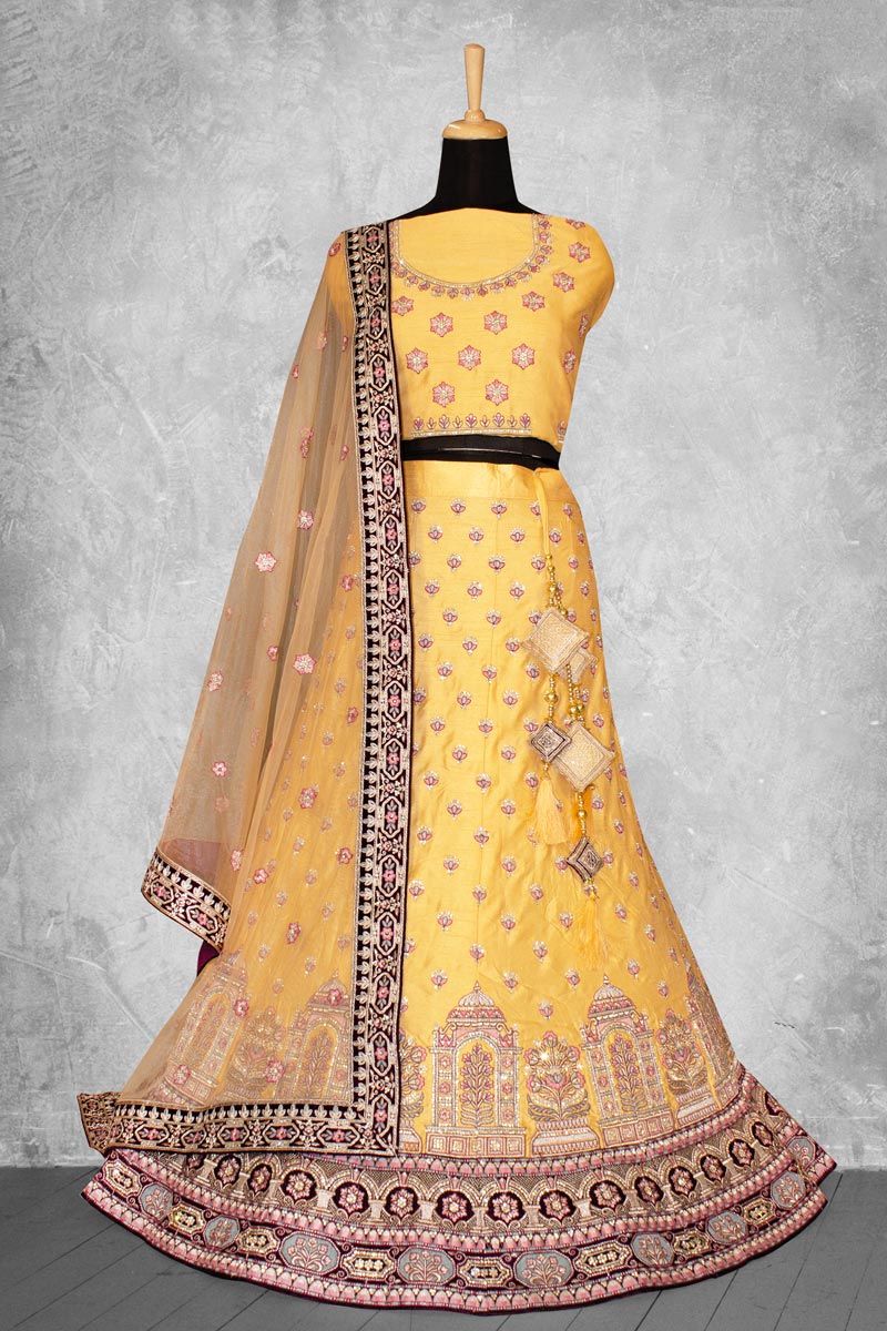 Radiant Embroidered Work On Yellow Color Art Silk Fabric Lehenga