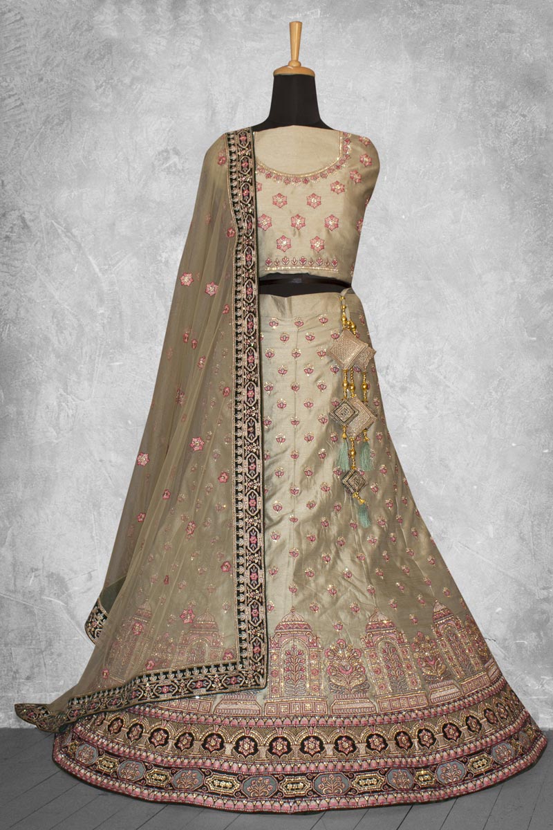 Excellent Art Silk Fabric Cream Color Lehenga With Embroidered Work