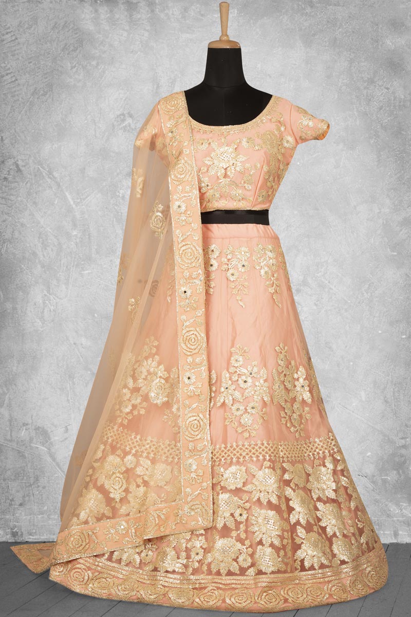 Classic Embroidered Work On Peach Color Lehenga In Net Fabric