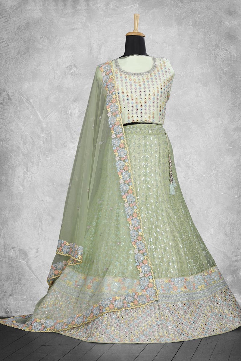 Charming Sea Green Color Net Fabric Lehenga With Embroidered Work